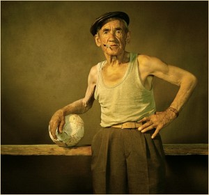 old man playing soccer