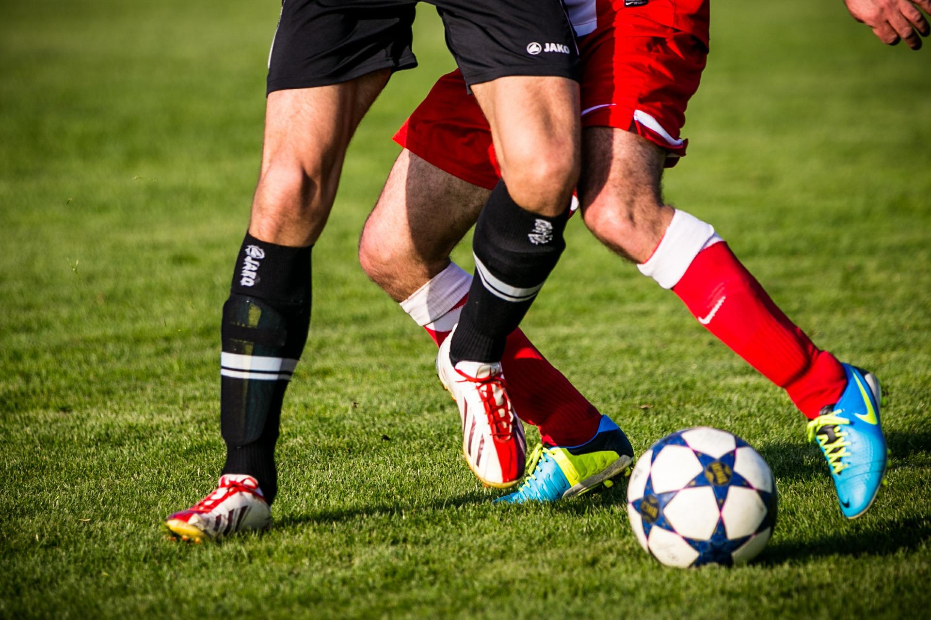 Adults playing soccer
